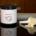 a container of protein powder next to a spoon