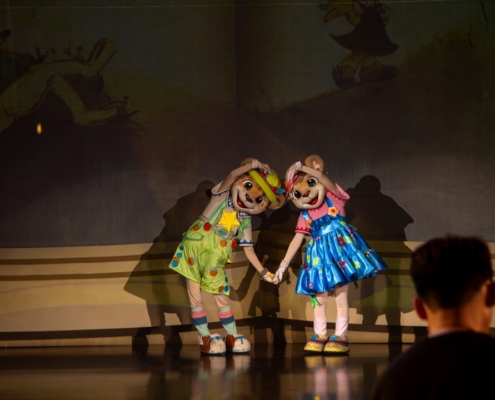 a couple of people that are standing on a stage