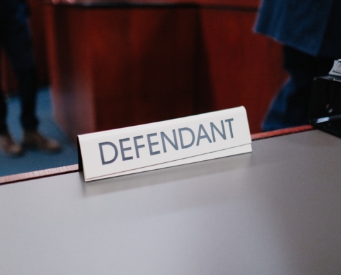 a desk with a sign on it that says defend