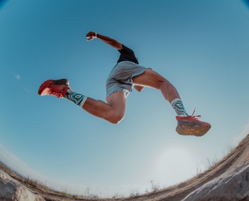 a man flying through the air while riding a skateboard