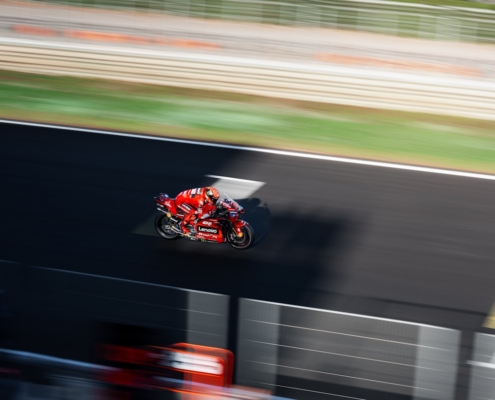 a person riding a motorcycle on a race track