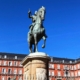a statue of a person riding a horse