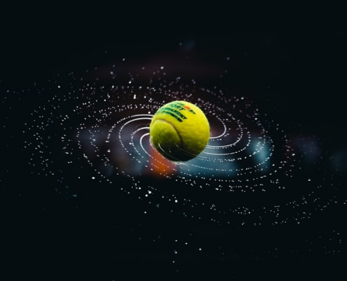 green and yellow ball on water