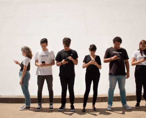 group of people standing on brown floor