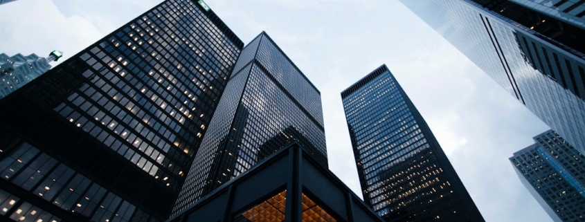 low angle photo of city high rise buildings during daytime