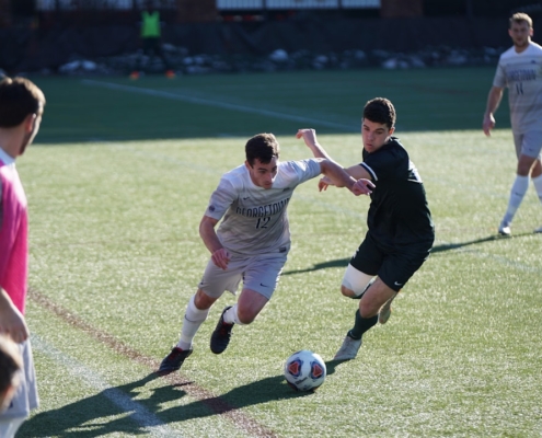 man playing soccer on the field