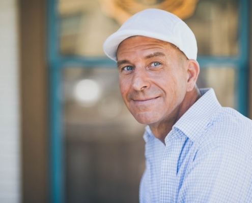 man smiling while sitting