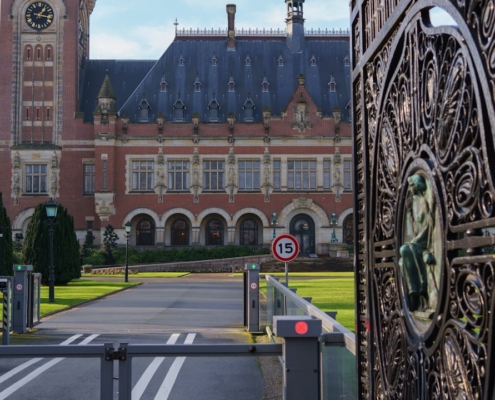 Ornate gate in front of a grand historic building