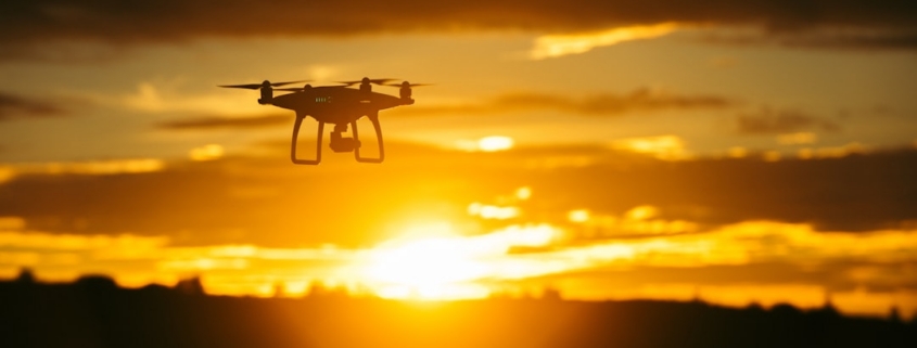 silhouette camera drone flying midair