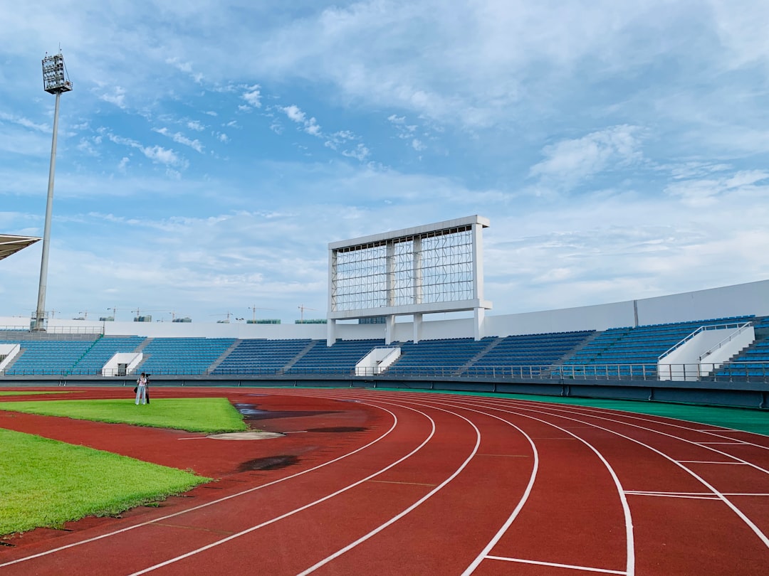 white and blue stadium under blue sky during daytime