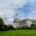 white concrete building under white clouds during daytime